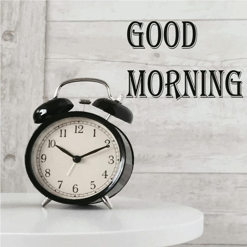 Black and white clock on a white table with Good Morning written over it